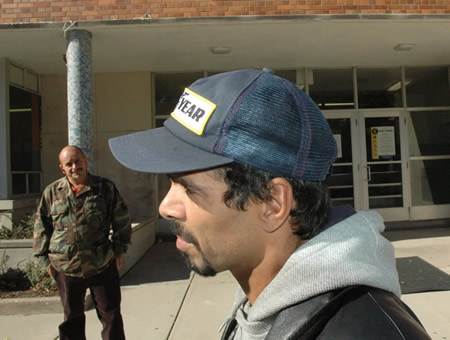 November 1, 2007: Two of the three men who identified themselves as “school security” at the CICS Irving Park “campus” on November 1 and told Substance that it was not permitted to photograph the school. On the right is “Roy”, who repeatedly tried to block the Substance camera from photographing and who identified himself as “chief of security” but refused to discuss the firm for whom he worked. The gentleman in the background refused to identify himself at all. Substance photo by George N. Schmidt.
